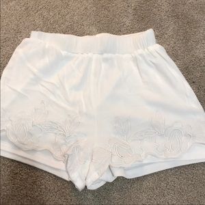 white embroidered flowy shorts